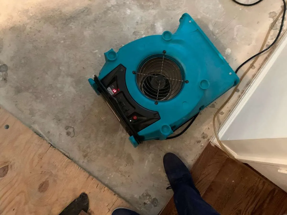 Air mover drying subfloor during Leak Detection & Repair in Barre